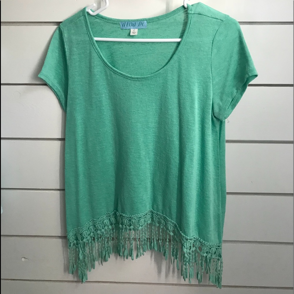 Teal shirt with fringe on the bottom